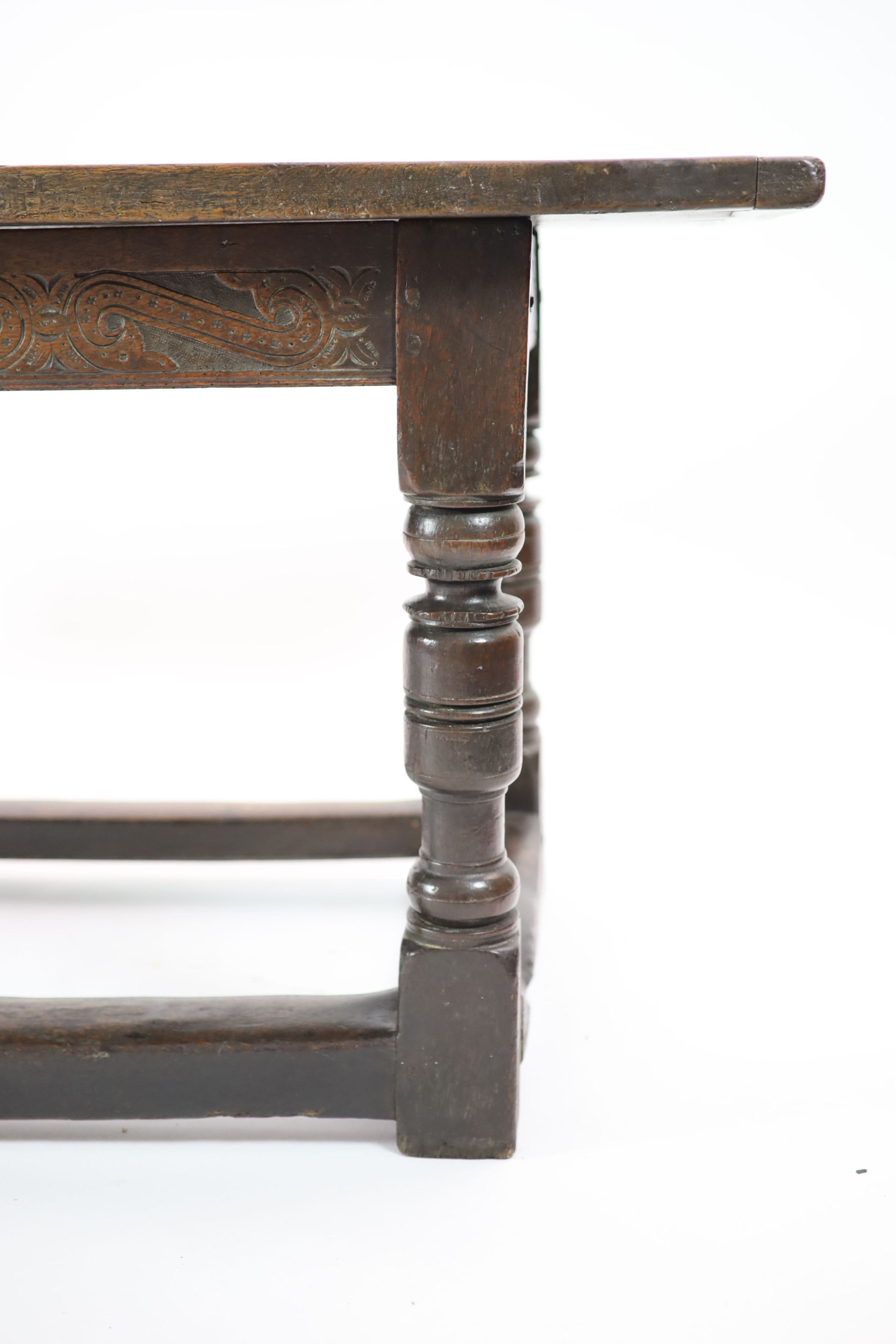 A Charles I oak refectory table, possibly West Country, having three-plank top H 74cm. W 220cm. D 76cm.